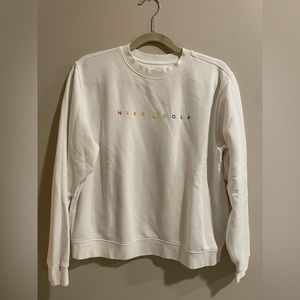 White Nike sweatshirt with rainbow “Nike Golf” stitching